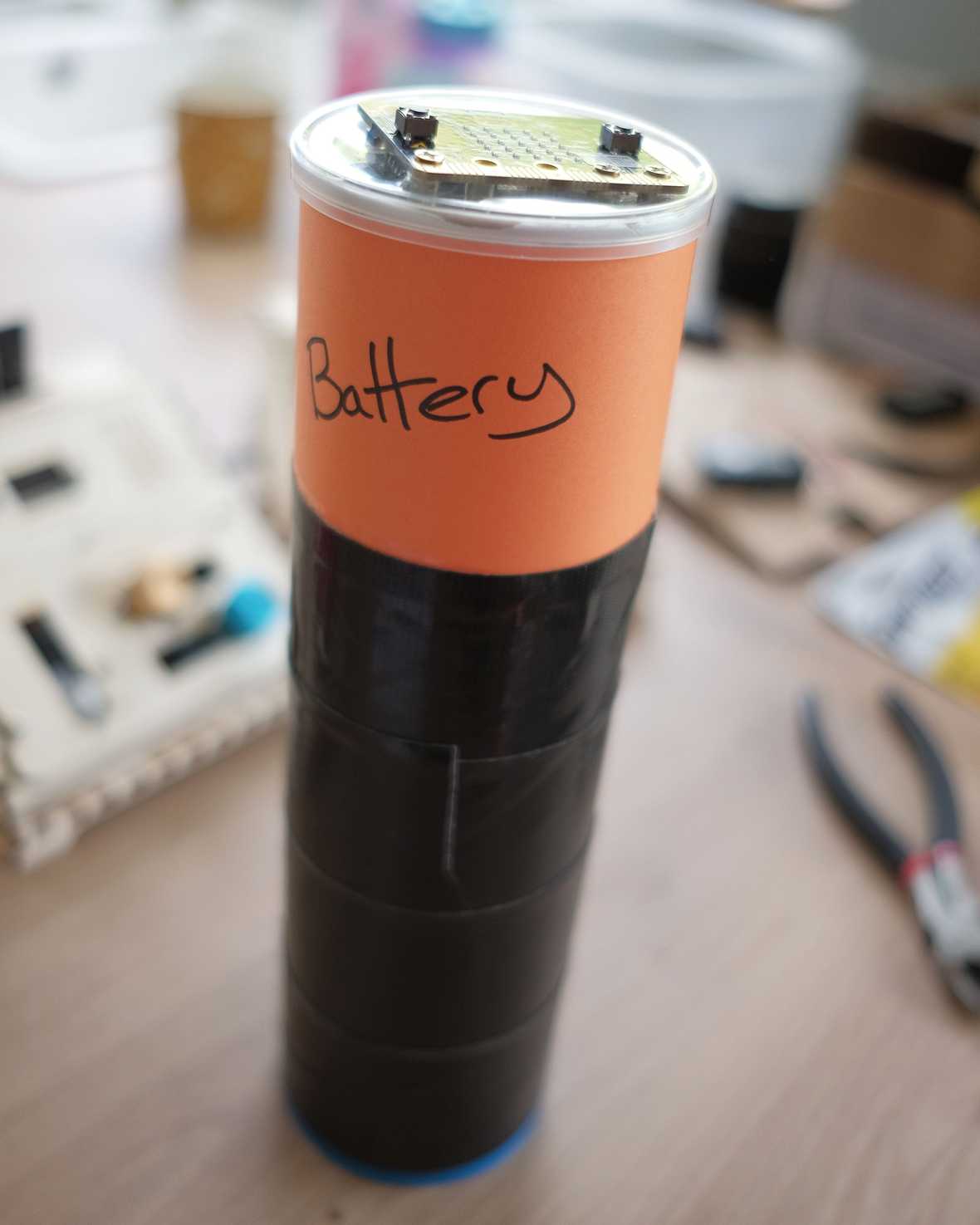 A large battery prop, made out of a Pringles can